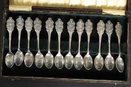 A collection of 12x Rolex Bucherer silver plated commemorative spoons.