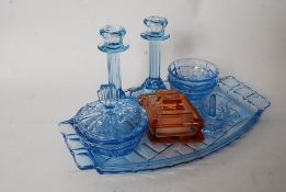 A 1930's Art Deco blue glass dressing table set comprising tray,