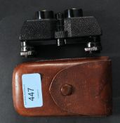 A pair of Karl Zeiss Theatis folding miniature binoculars, retailed by Negretti and Zambia,