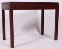 A 20th century Air Ministry marked dark teak wood swivel top games / card table.