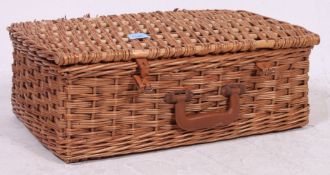 A 1950's whicker hamper complete with contents to include staffordshire china and tupperware.