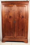 A 19th century French solid armoire double wardrobe.
