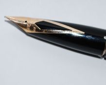 A fabulous 14ct gold nib Sheaffer fountain pen having criss cross pattern case and cap being 14ct