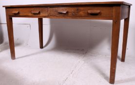 An excellent early 20th century Air Ministry oak large writing table desk being raised on squared