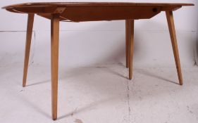 A fabulous 1950's large Ercol Windsor pattern beech and elm refectory dining table having 5 legs.
