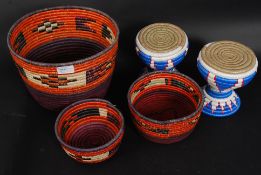 A collection of tribal weave South African baskets / pots from recycled carrier bags
