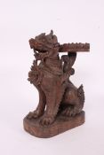 A good quality large Pomanda stand in the form of a Chinese temple dog - fu dog having circular