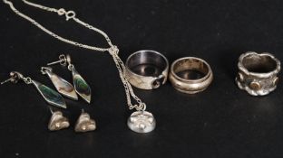 A collection of silver to include ladies rings and earrings.