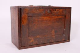 A early to mid 20th century engineers tool box having a bank of five drawers and a drop down