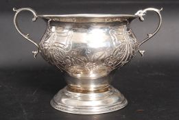 An Edwardian hallmarked silver ( London 1922 ) twin handled bowl with engraving sides,