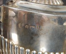 An Edwardian silver hallmarked teapot bearing marks for Birmingham 1908 by Williams Ltd. Weight 246.
