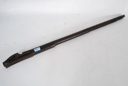 An early, possibly British military issue ( Lee Enfield ) flintlock wooden rifle barrel housing.