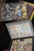 A collection of foreign and British coins and stamps