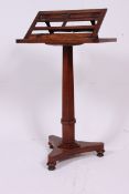 A 19th century Regency pedestal mahogany music stand / lecturn.