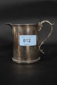 A silver hallmarked Victorian creamer by Robert Harker bearing London hallmarks for circa 1860