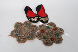 A pair of woodland 19th century American Indian beaded roundels together with a pair of beaded