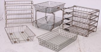 A collection of Industrial mid 20th century paper stacking filing trays of mesh form together with
