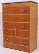 A twentieth century tall boy chest of drawers with mirror, and opening straight five drawers.