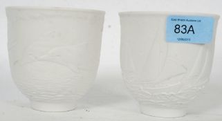 A 1998  Lladro Collectors Society dolphins bisque ware votive candle holder / vase together with a