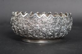 A 20th century Indian / Siam silver (unmarked white metal) asiatic finger bowl cast in relief