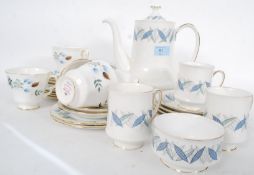 A Royal Standard ' Trend ' pattern part tea service including the teapot together with a Colclough