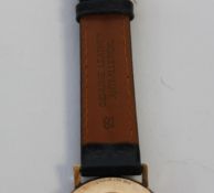 A 9ct gold Tissot swiss gentlemans wristwatch on leather strap.