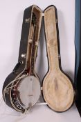 A cased Alvarez banjo, 5 string model, made of mahogany,