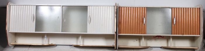 2 retro 1950's painted wall cabinets having sliding doors - with sectional bodies.