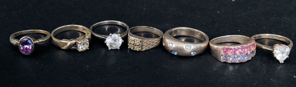 A collection of 7 contemporary silver ladies dress rings to include claw mounted stone set,