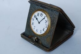 A good early 20th century Goliath easel travel pocket watch set within a snakeskin case.