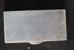 A silver hallmarked vinaigrette case being engine turned and of rectangular form.