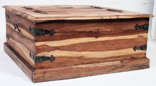 A 20th century hardwood contemporary pandora's box coffee table having hinged top with compartments