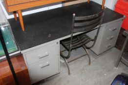 A 1970's Industrial metal twin pedestal office desk.