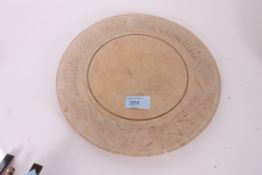 An early 20th century wooden French chopping board with notation to the outer borders