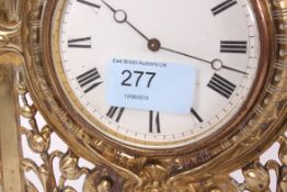 A 20th century brass surround easel clock, with fret pierced detail.