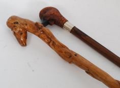 Two carved 20th century zoomorphic walking sticks.
