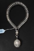 A Victorian Art Nouveau large silver locket and collar necklace.
