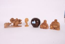 A collection of carved Buddha figures in