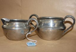 A 19th century Arts & Crafts hammered pe