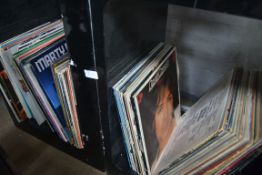 A collection of vinyl records to include
