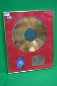 A framed and glazed gold record - Simply