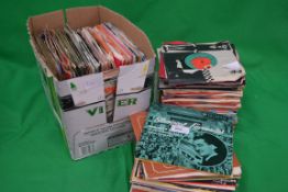 A collection of vinyl singles  45's to i
