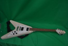 A Flying V electric guitar having 6 stri