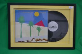 A framed and glazed vinyl LP record for
