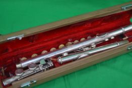 A Chinese cased flute in chrome