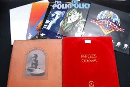 A colllection of vinyl records to includ