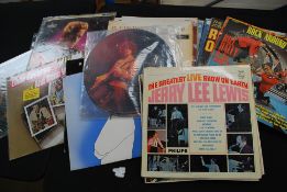 A collection of vinyl records to include