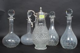 Four vintage cut glass decanters all with stoppers along with a pressed glass and silver plate