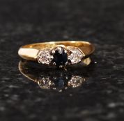 An 18ct gold diamond and sapphire ring.