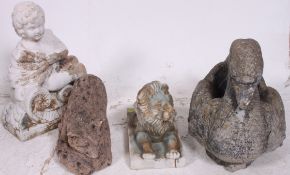 A collection of garden ornaments to include hollow cast lion,